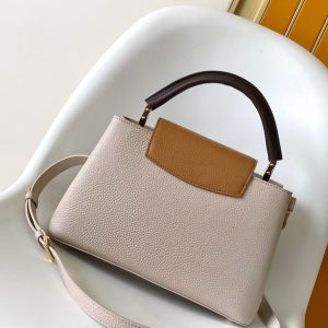 Alternative view of p125031.05 x 20.0 x 11.0 cm (L x H x W)27.0 x 17.3 x 9.0 cm (L x H x W)21.0 x 13.6 x 8.0 cm (L x H x W)•Taurillon calf leather•Calf leather trim•Cowhide leather lining•Metal hardware•Flap can be positioned inside or outside•Zippered interior pocket•Interior slip pocket•Metal studs•Holds smartphone, LV Vertical wallet, headphones, and keys•Shoulder strap: Detachable, adjustable•Strap length: 45.5 cm•Adjustable to: 53.0 cm•Handle: Single handle